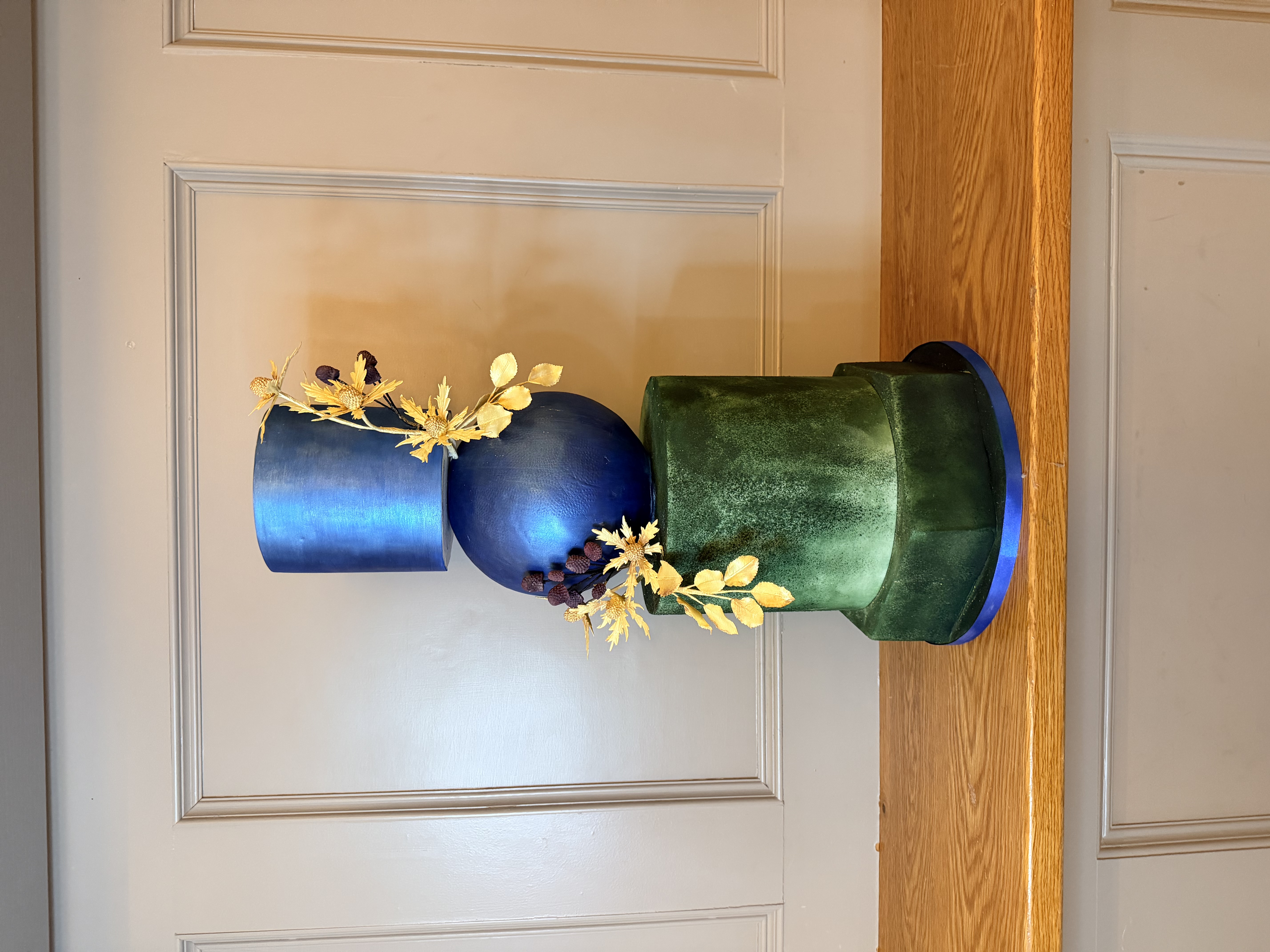 I am pushing the boundaries of cake architecture with a gravity defying sphere and hand finished emerald textures. — Crumbdidilyumptious, Glenrothes, fife