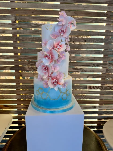 Modern geometric gold detailing paired with delicate hand painted sugar orchids for a high impact, fresh aesthetic. — Crumbdidilyumptious, Glenrothes, fife