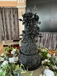Dramatic, gothic inspired sugar artistry. This all black masterpiece focuses on intricate texture and structural depth. — Crumbdidilyumptious, Glenrothes, fife